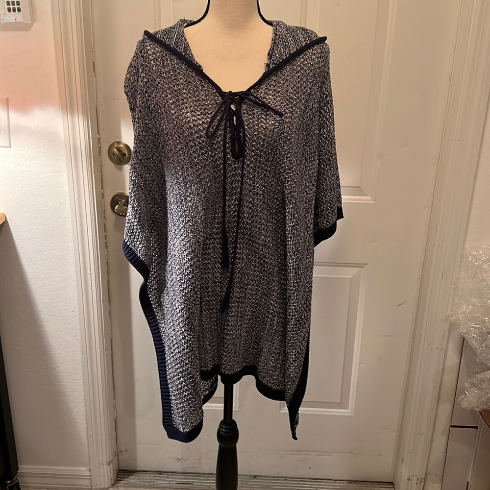 Hooded knit high-low poncho.